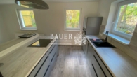 Küche mit Kochinsel - 5-Zimmer Wohnung im Ehrlenbachtal
