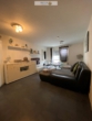 Wohnzimmer mit Balkonzugang - 2-Zimmerwohnung mit Balkon und Tiefgaragenstellplatz in Kornwestheim